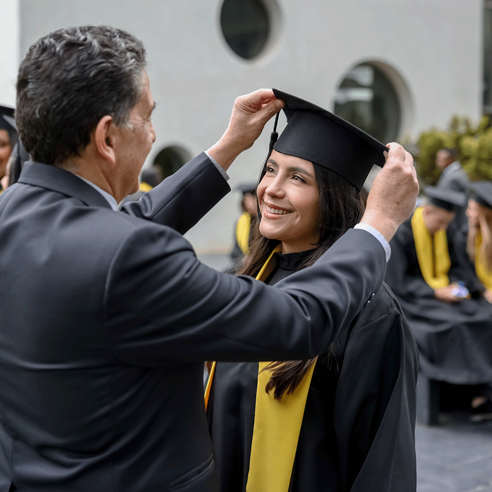 College graduate and father celebrating