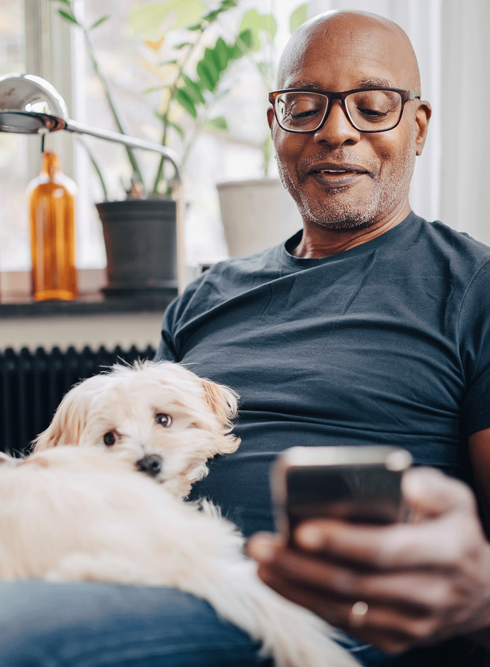 Man nearing retirement checking his mobile phone