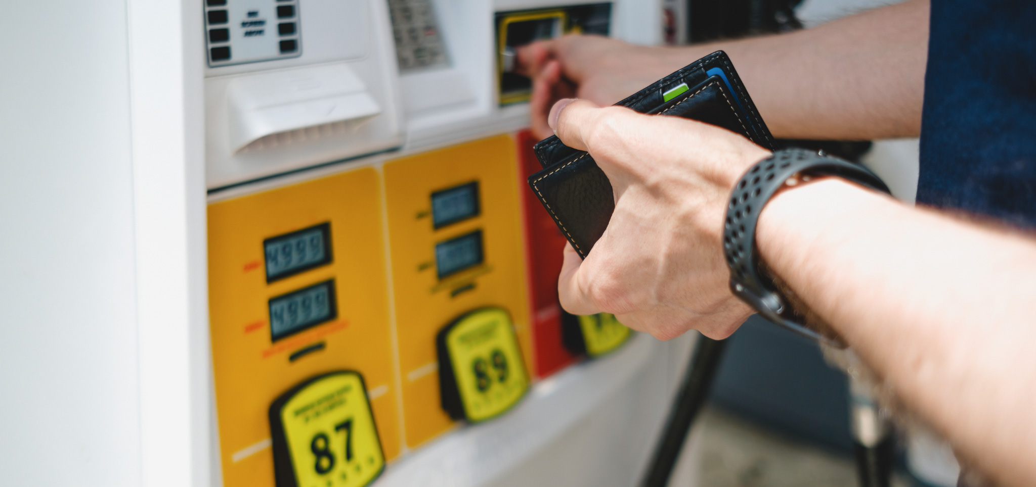 A person paying for gas with their credit card.