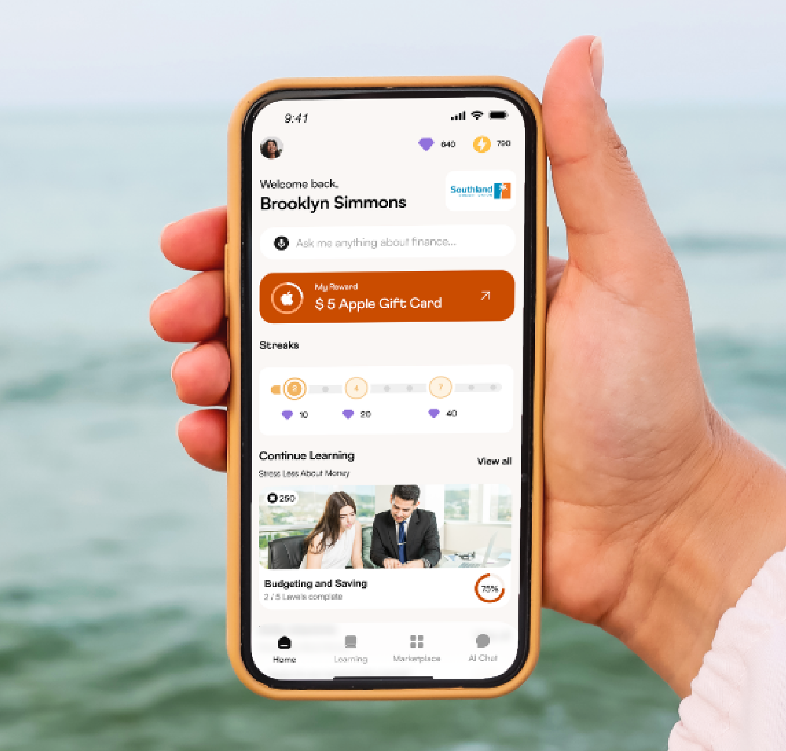 Person holding their phone to show the Doshi app