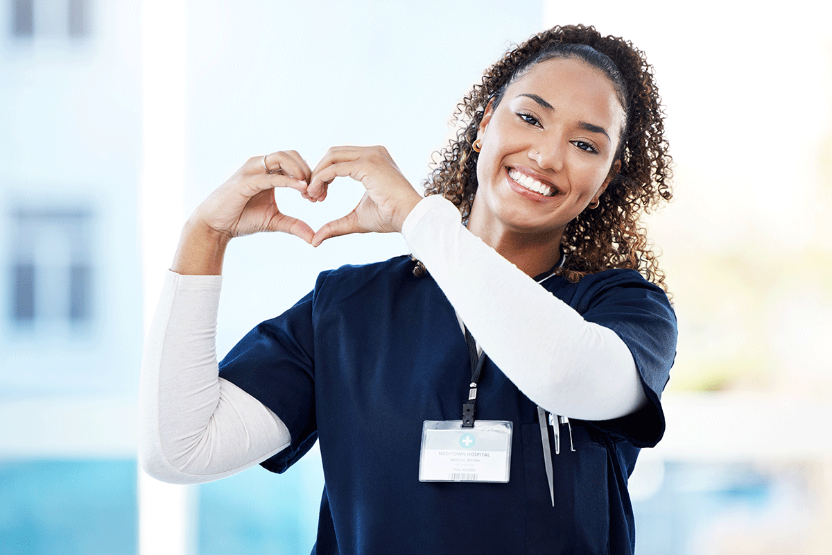 nurse making heart sign