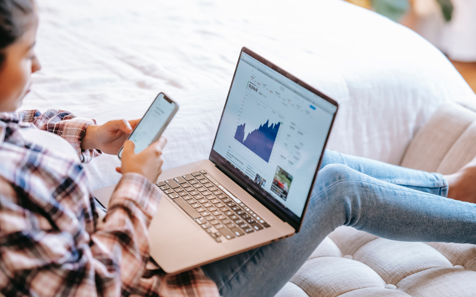 Woman checking her stocks on her phone