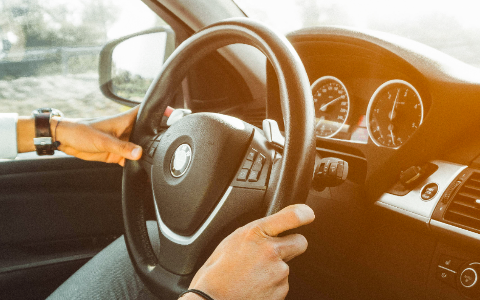 Man driving BMW car