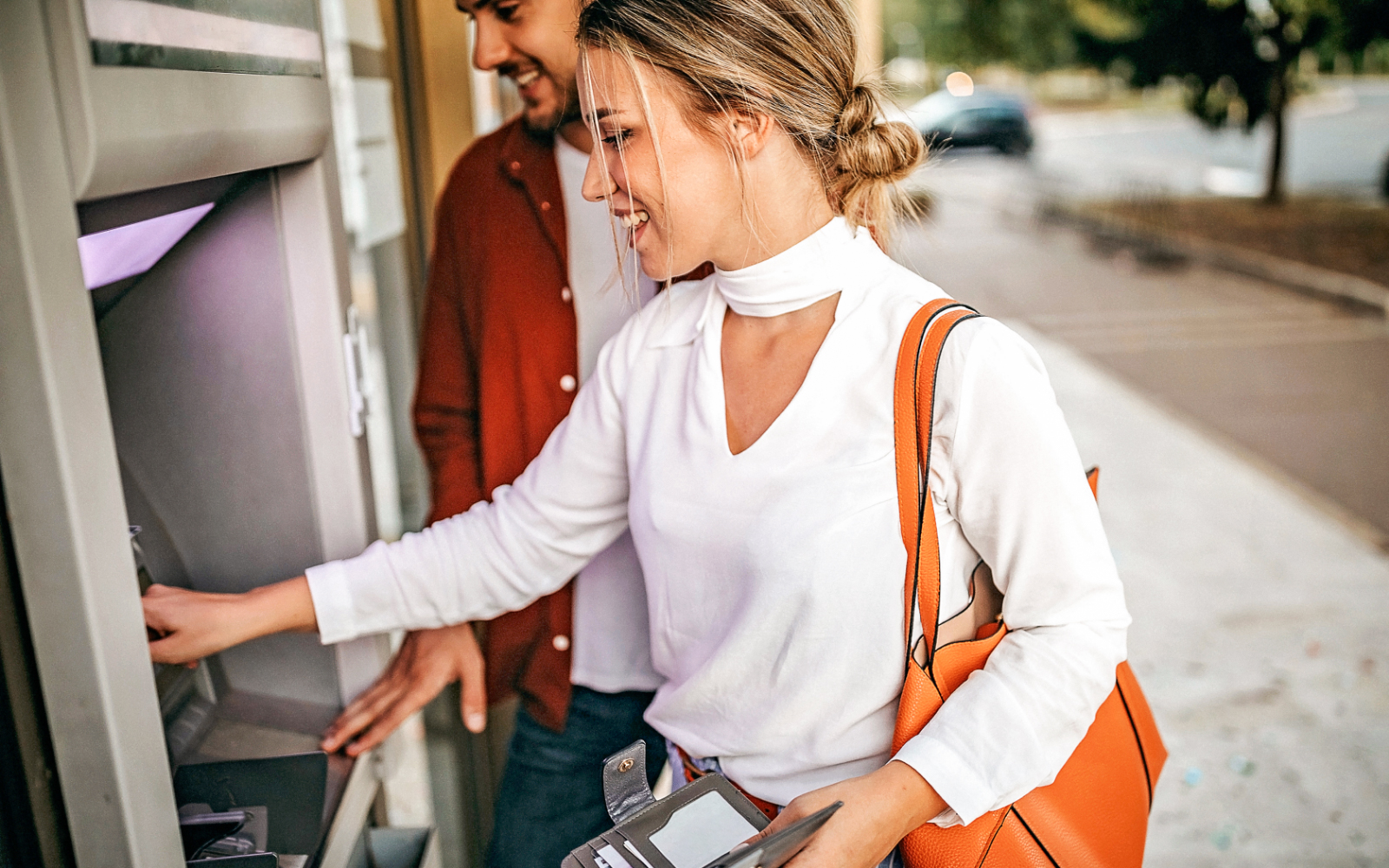 Woman using the ATM