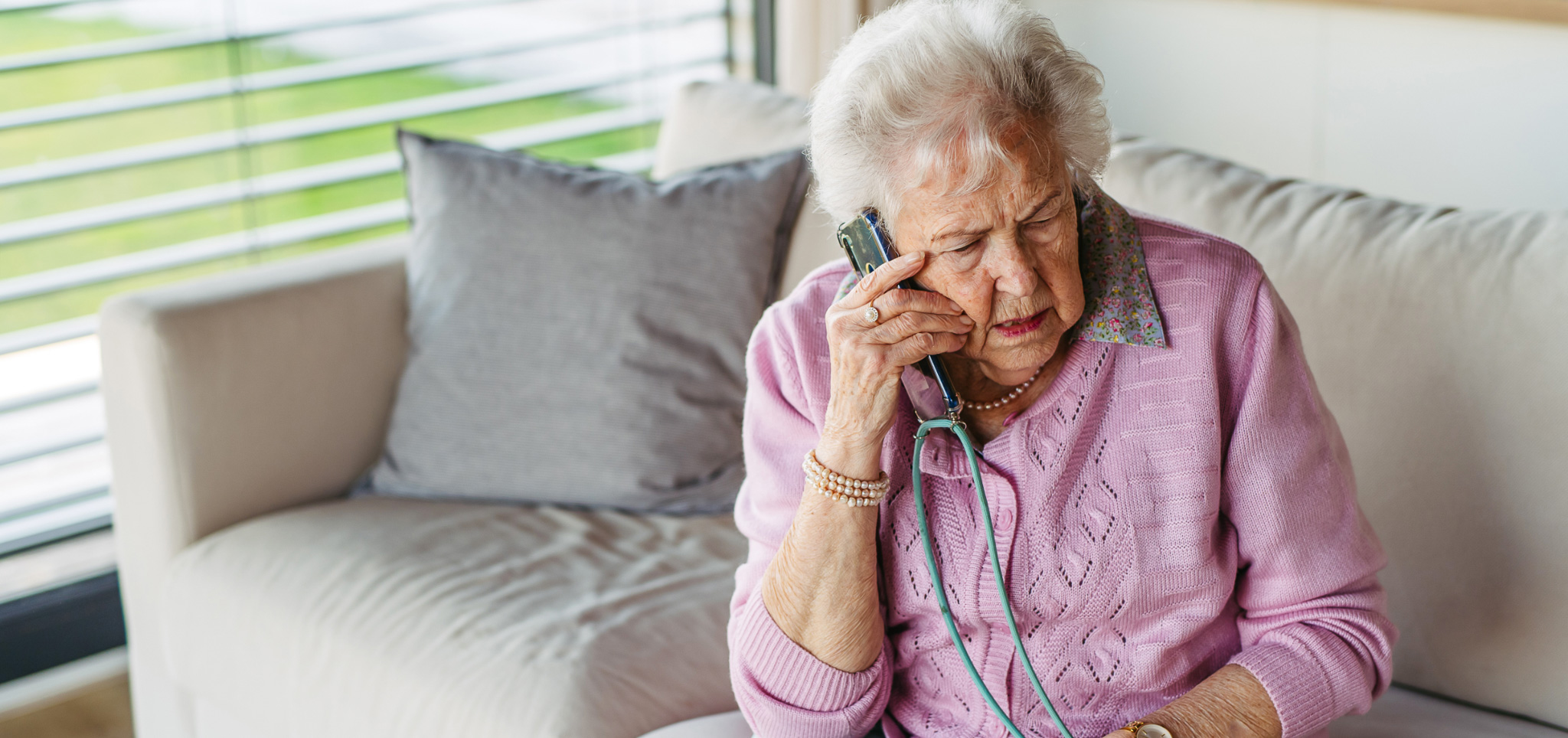 An elderly woman on the phone