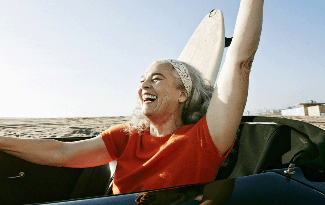 Elderly woman driving convertible